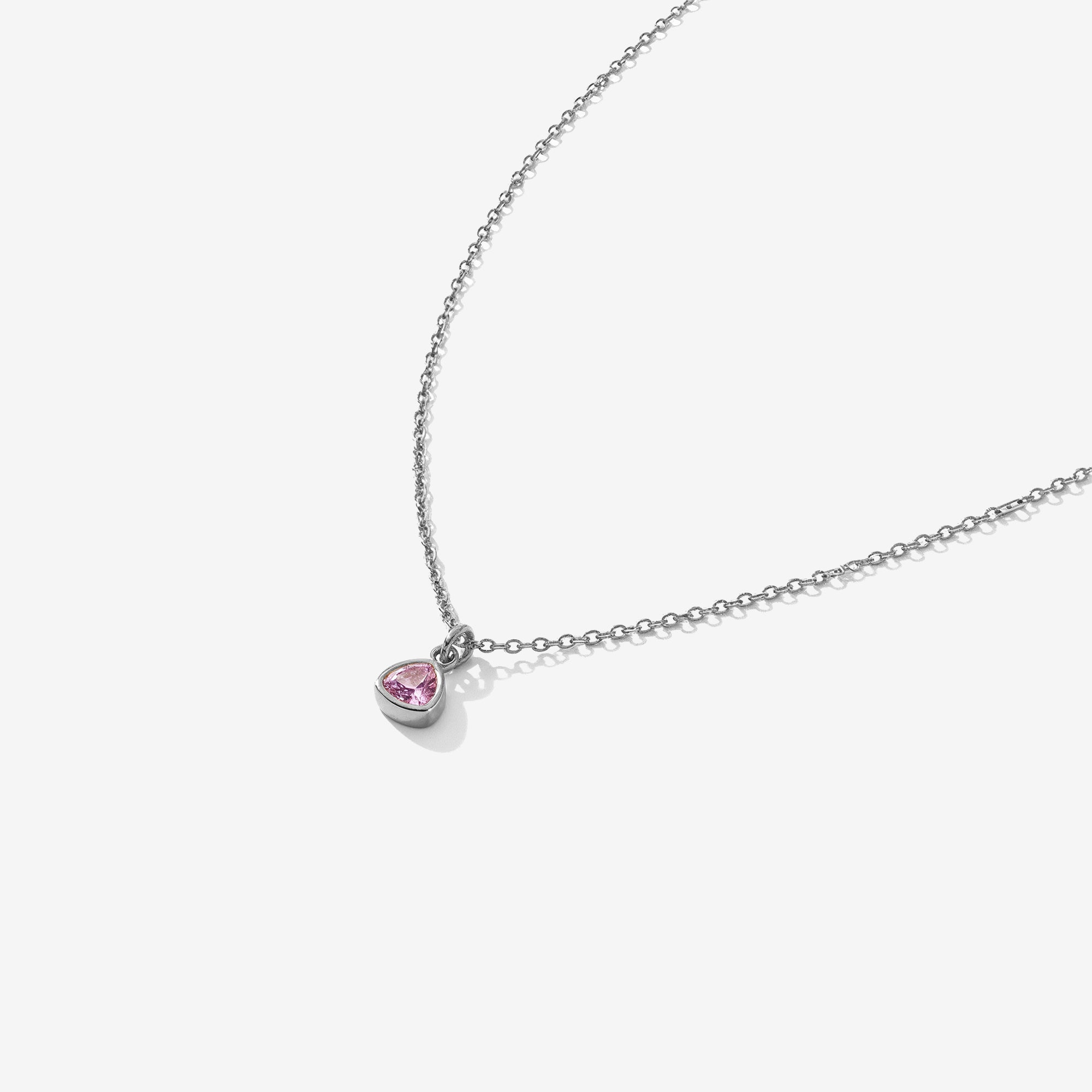 Necklace with a pink heart-shaped pendant on a white background