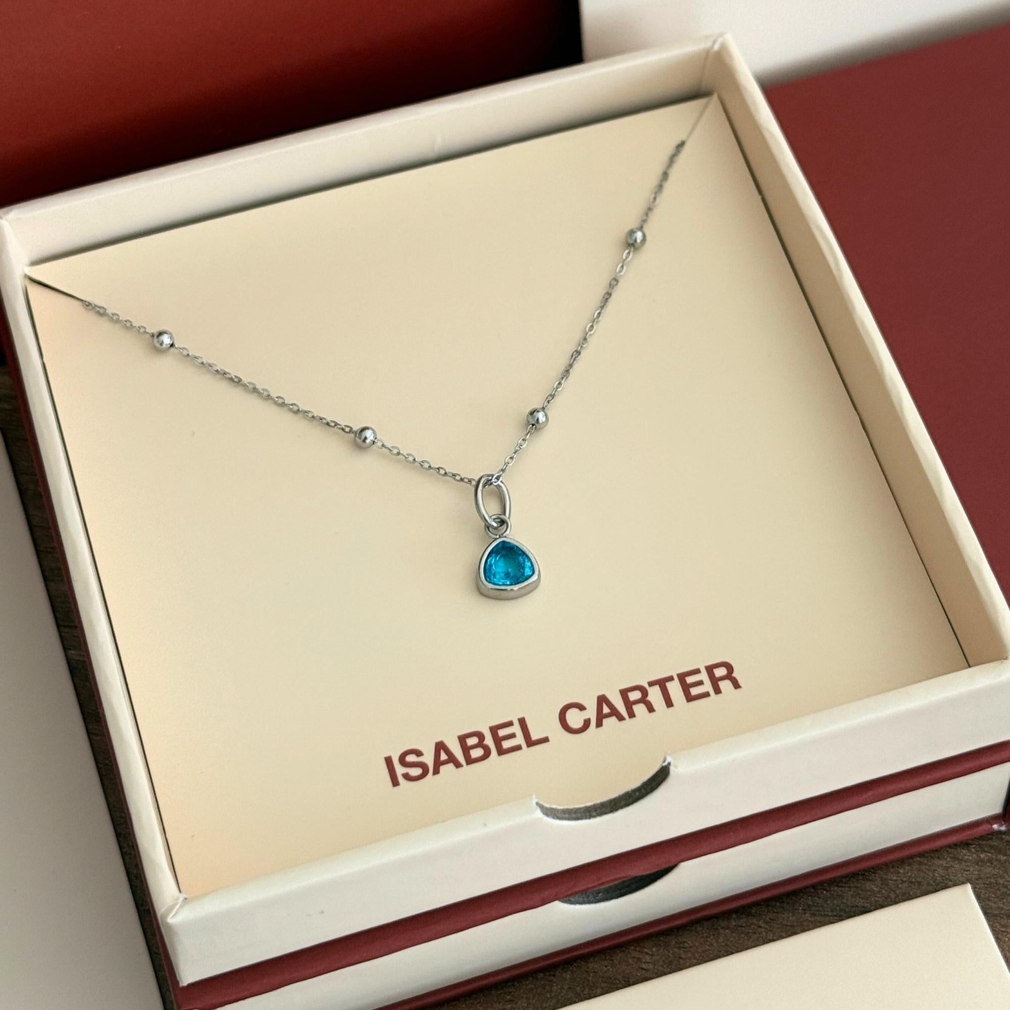 Necklace with a march aquamarine birthstone pendant in an 'Isabel Carter' box